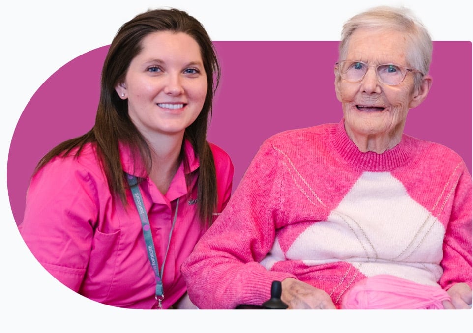 A carer and a client who receives domestic care smiling