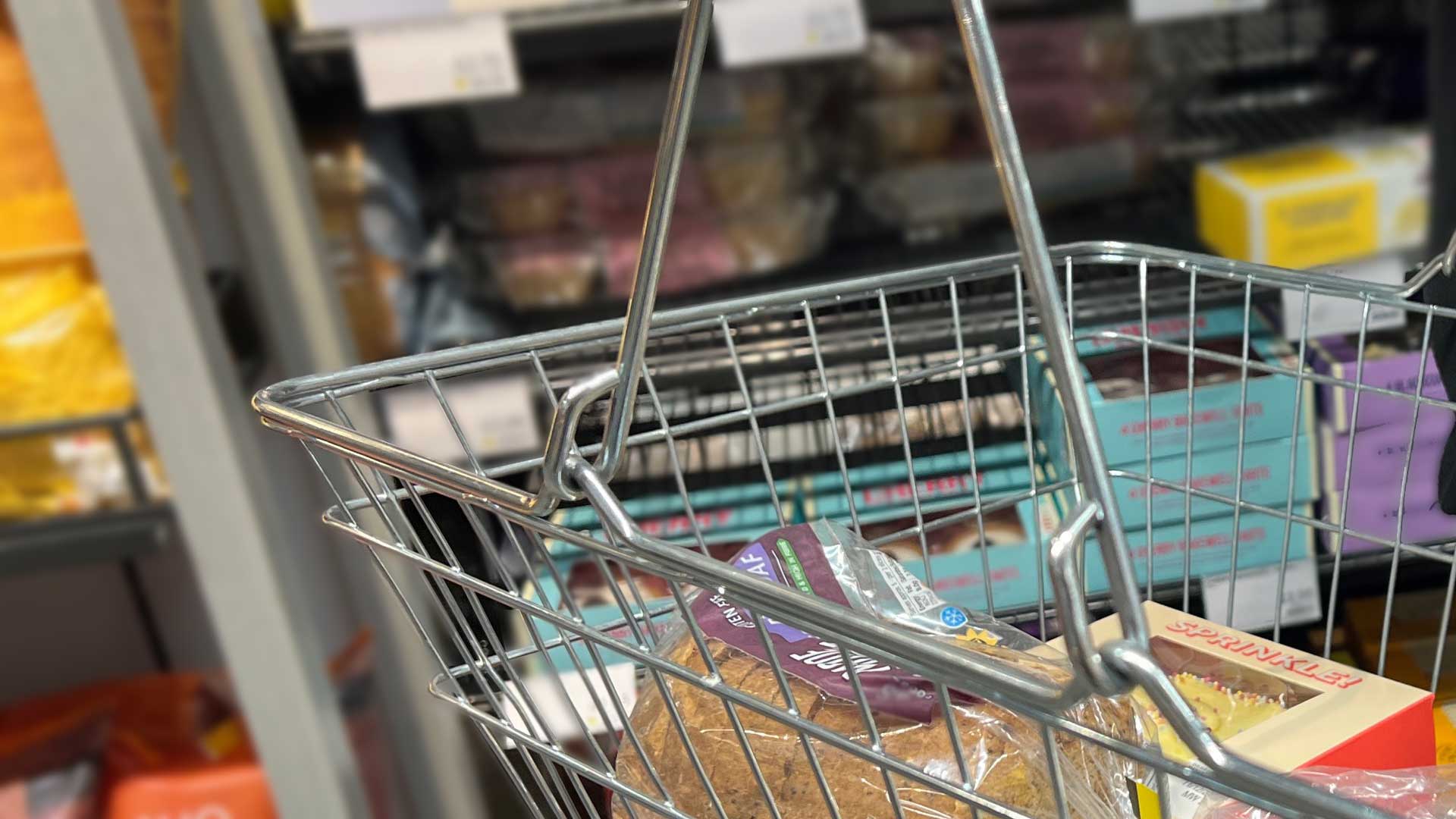 A picture of a basket in a retail setting.