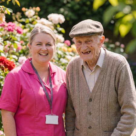 An elderly man smiling with his Home Carer